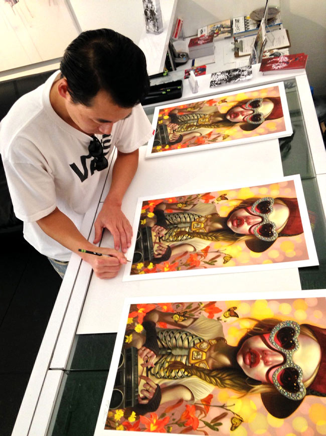 Young Chun - Aritst Signing Prints (Photo Courtesy of CAVE Gallery)